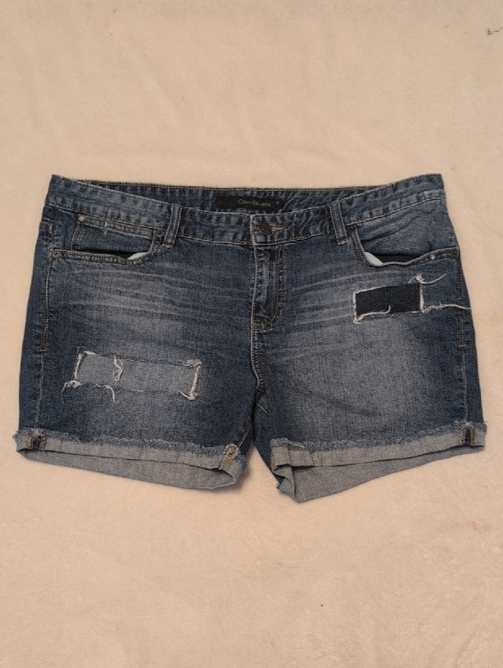 Calvin Klein Woman's Medium Blue Distressed Denim Roll-Hem Shorts 32/14